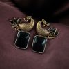 Two-tone peacock earrings with stone work in traditional look alike design.