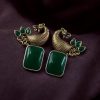 Two-tone peacock earrings with stone work in traditional look alike design.