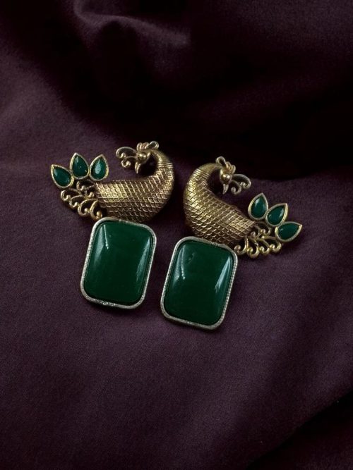 Two-tone peacock earrings with stone work in traditional look alike design.