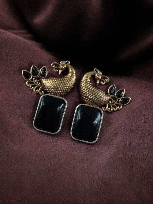 Two-tone peacock earrings with stone work in traditional look alike design.