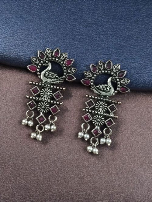 Brass peacock earrings with intricate design, lightweight and elegant