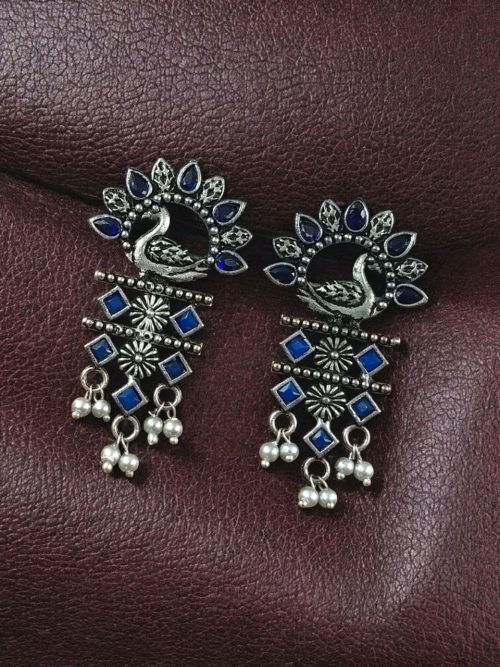 Brass peacock earrings with intricate design, lightweight and elegant