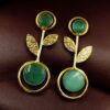 Gold plated floral art earrings with Monalisa stone and leaf design for ethnic and western wear.Elegant gold plated earrings with floral art and Monalisa stone – a perfect ethnic and western fusion.