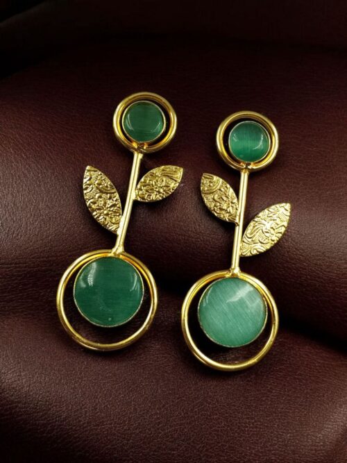 Gold plated floral art earrings with Monalisa stone and leaf design for ethnic and western wear.Elegant gold plated earrings with floral art and Monalisa stone – a perfect ethnic and western fusion.