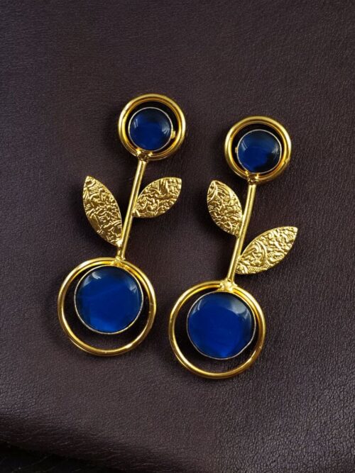 Gold plated floral art earrings with Monalisa stone and leaf design for ethnic and western wear.