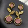 Gold plated floral art earrings with Monalisa stone and leaf design for ethnic and western wear.