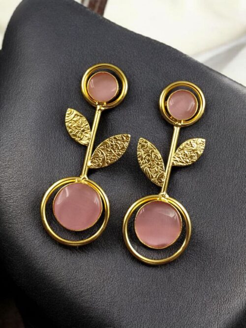 Gold plated floral art earrings with Monalisa stone and leaf design for ethnic and western wear.