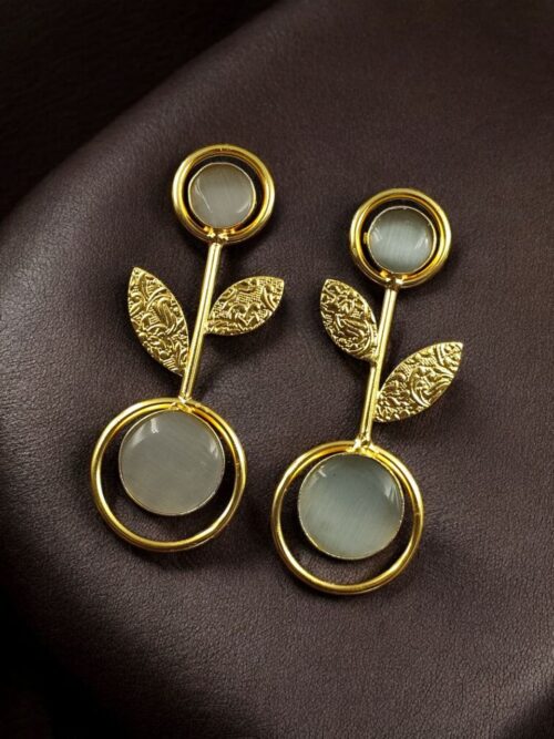 Gold plated floral art earrings with Monalisa stone and leaf design for ethnic and western wear.