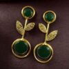Gold plated floral art earrings with Monalisa stone and leaf design for ethnic and western wear.
