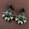 Traditional oxidized silver replica peacock earrings with pearl and stone work.
