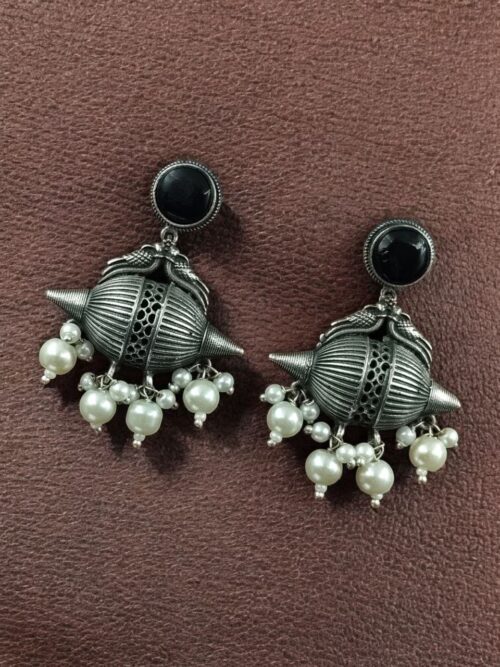 Traditional oxidized silver replica peacock earrings with pearl and stone work.