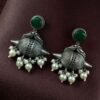 Traditional oxidized silver replica peacock earrings with pearl and stone work.