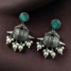 Traditional oxidized silver replica peacock earrings with pearl and stone work.