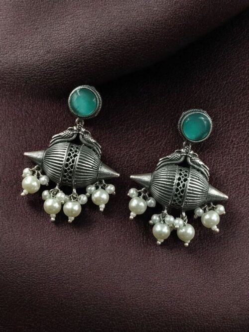 Traditional oxidized silver replica peacock earrings with pearl and stone work.