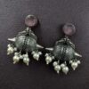 Traditional oxidized silver replica peacock earrings with pearl and stone work.