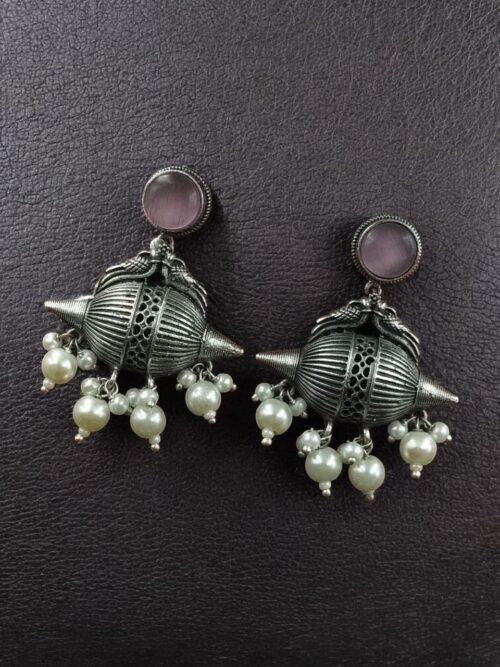 Traditional oxidized silver replica peacock earrings with pearl and stone work.