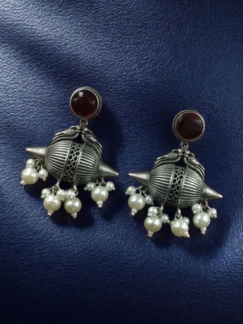 Traditional oxidized silver replica peacock earrings with pearl and stone work.