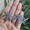 Oxidized silver plated long leaf hook dangler earrings for women.