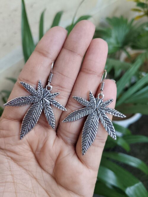 Oxidized silver plated long leaf hook dangler earrings for women.
