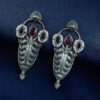 Traditional oxidized silver plated stud earrings with pearl and stone work
