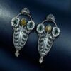 Traditional oxidized silver plated stud earrings with pearl and stone work
