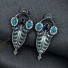 Traditional oxidized silver plated stud earrings with pearl and stone work