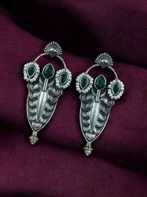 Traditional oxidized silver plated stud earrings with pearl and stone work