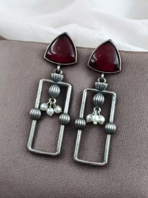 Geometric pearl dangler earrings in oxidized silver finish