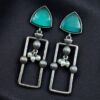 Geometric pearl dangler earrings in oxidized silver finish