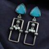 Geometric pearl dangler earrings in oxidized silver finish