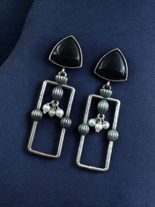 Geometric pearl dangler earrings in oxidized silver finish