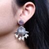 Traditional oxidized silver replica peacock earrings with pearl and stone work.