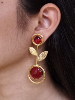 Gold plated floral art western look earrings with Monalisa stone and leaf design for ethnic and western wear.