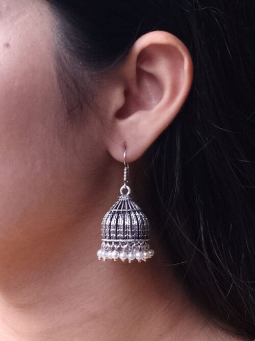 Oxidized German silver pearl work jhumka earrings in hook dangler design.