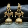 Gold plated bird dangler earrings with pearl and stone work.