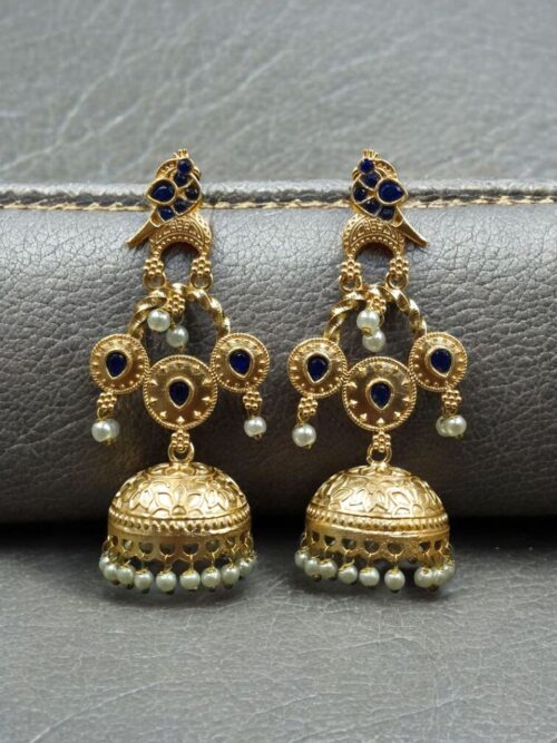 Gold plated bird dangler earrings with pearl and stone work.
