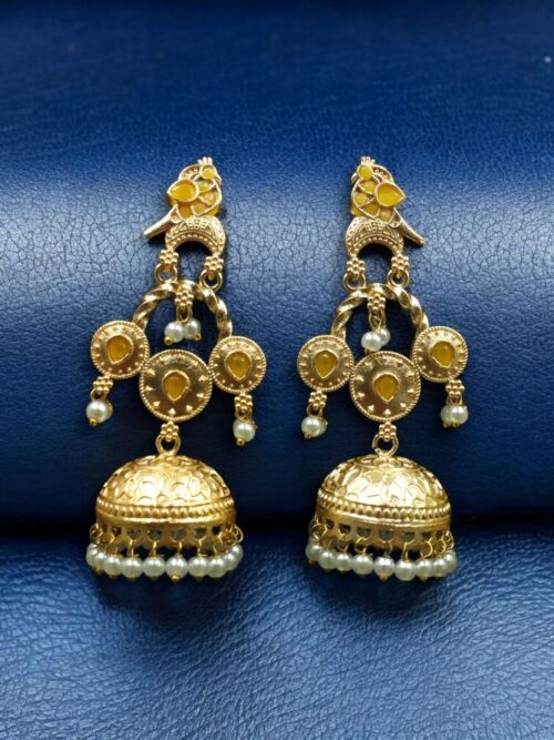Gold plated bird dangler earrings with pearl and stone work.