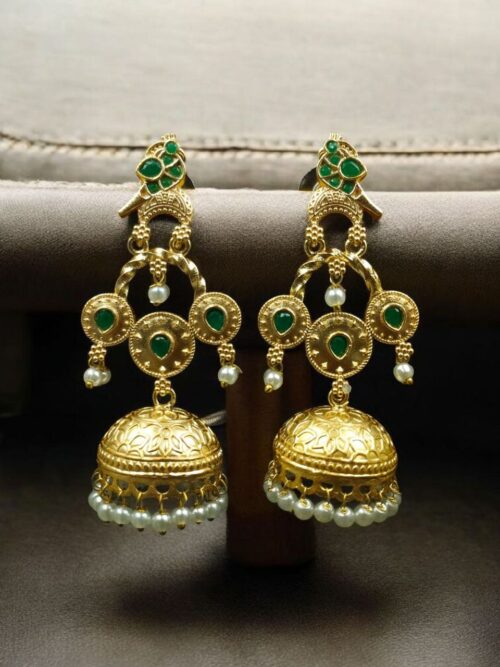 Gold plated bird dangler earrings with pearl and stone work.