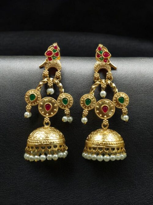 Gold plated bird dangler earrings with pearl and stone work.