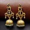 Gold plated bird dangler earrings with pearl and stone work.