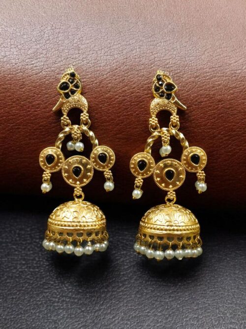 Gold plated bird dangler earrings with pearl and stone work.