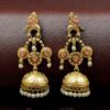 Gold plated bird dangler earrings with pearl and stone work.