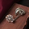 Silver plated half moon chain ring with flower and ghungroo design.