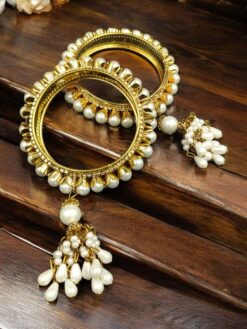 Traditional gold plated bangle with stone detailing.