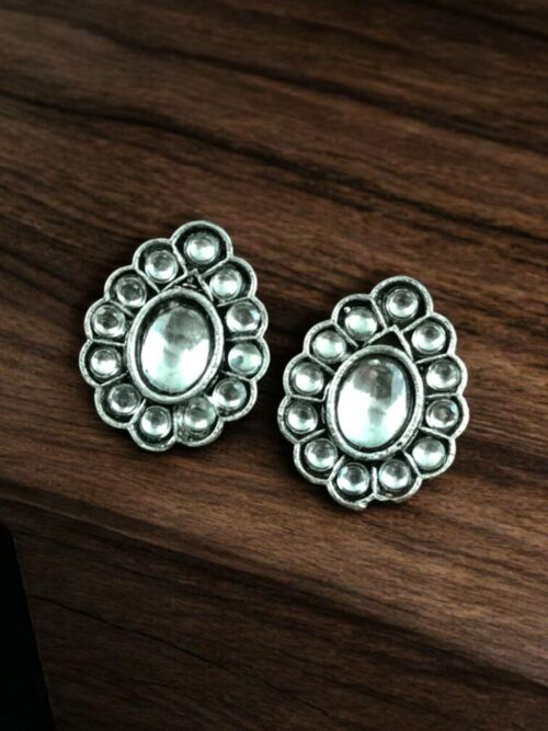 Silver replica stud earrings with stone work for daily wear.