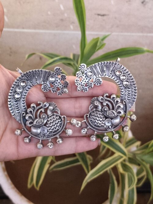 Oxidized silver replica peacock earcuff with ethnic design.
