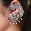Oxidized silver replica peacock earcuff with ethnic design.