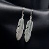 Oxidised feather design German silver earrings for women.