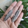 Oxidised feather design German silver earrings for women.