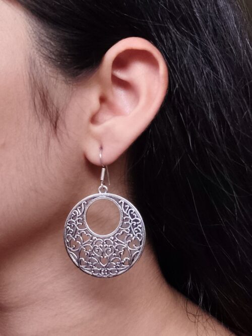 German silver floral art circle dangler earrings for women.